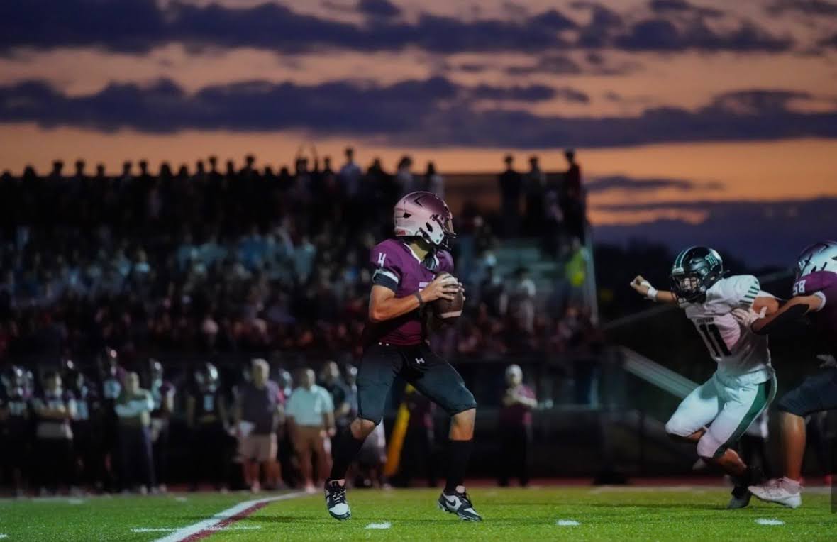 Jack captured throwing a touchdown during the Yorktown game on September 7, 2025